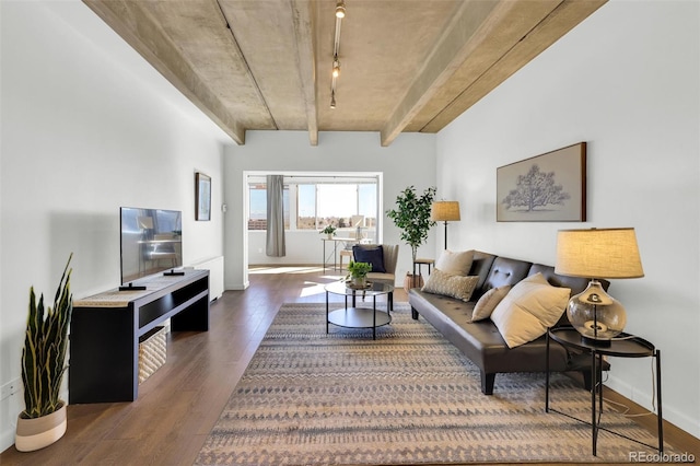 living room with beamed ceiling, track lighting, baseboards, and wood finished floors