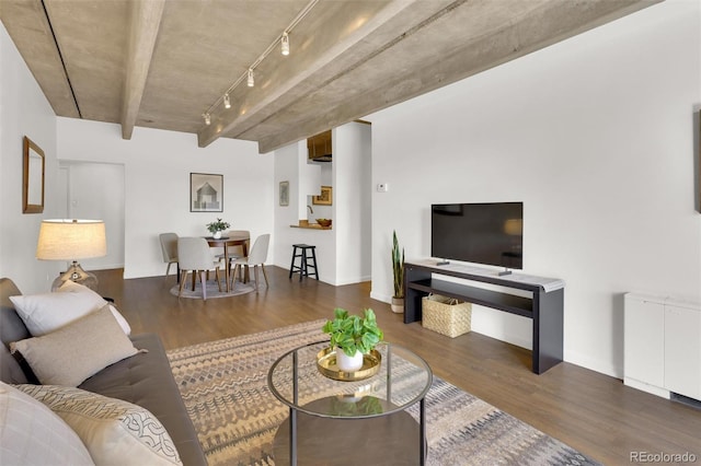 living room with wood finished floors and track lighting