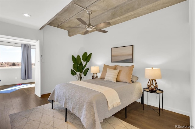 bedroom with hardwood / wood-style flooring, a ceiling fan, and baseboards