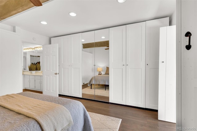 bedroom featuring recessed lighting and wood finished floors