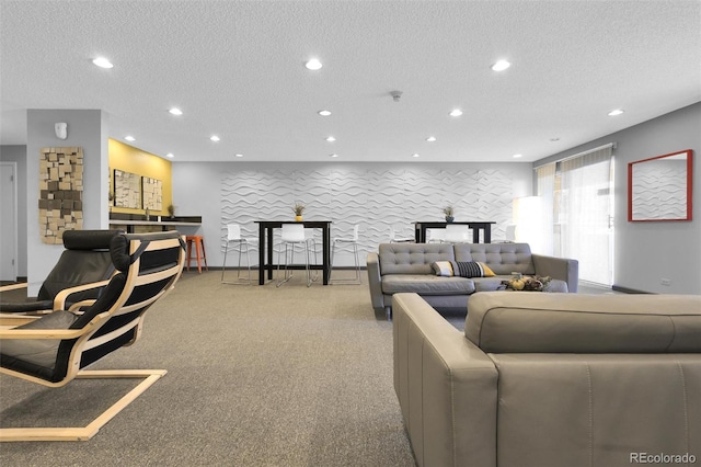 living area featuring recessed lighting, a textured ceiling, and light colored carpet