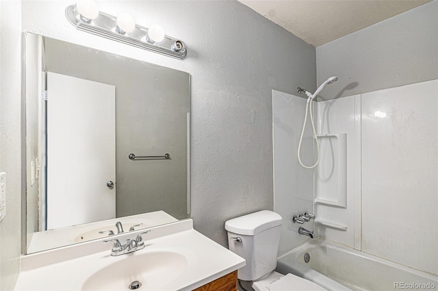 full bathroom with vanity, toilet, and washtub / shower combination