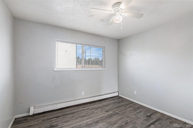 empty room featuring ceiling fan, dark hardwood / wood-style floors, a textured ceiling, and baseboard heating