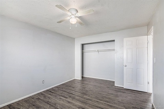 unfurnished bedroom featuring dark wood-type flooring, a closet, and a textured ceiling