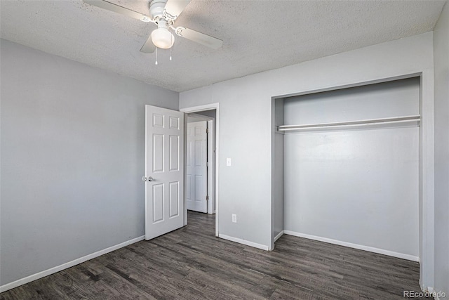 unfurnished bedroom with ceiling fan, dark hardwood / wood-style floors, a textured ceiling, and a closet