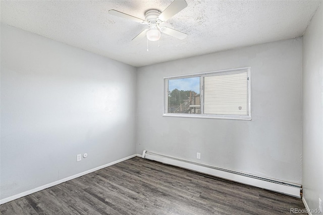 spare room with dark hardwood / wood-style flooring, ceiling fan, a textured ceiling, and baseboard heating