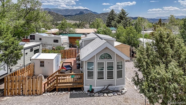 10795 County Road 197a Unit 184, Nathrop, CO 81236 - back of house with a storage shed and a deck with mountain view