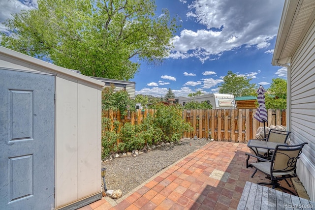 10795 County Road 197a Unit 184, Nathrop, CO 81236 - fenced backyard with a storage unit and a patio