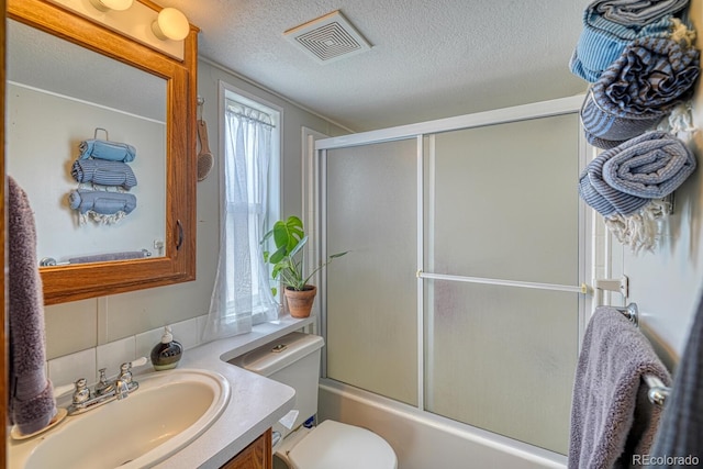 10795 County Road 197a Unit 184, Nathrop, CO 81236 - bathroom featuring vanity, combined bath / shower with glass door, and a textured ceiling