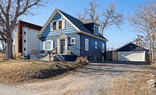 view of front of house featuring an outbuilding and a detached garage