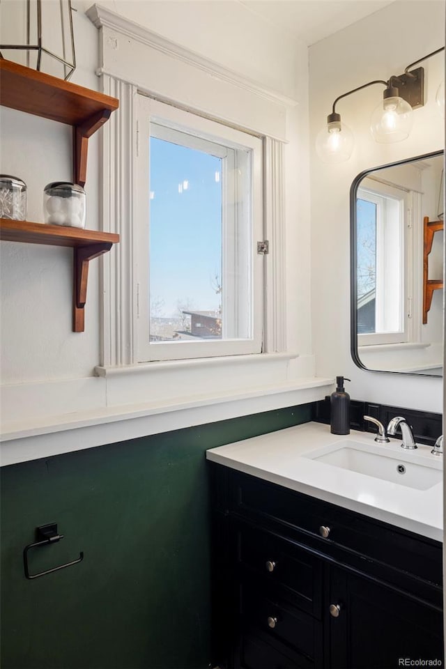 bathroom featuring plenty of natural light and vanity