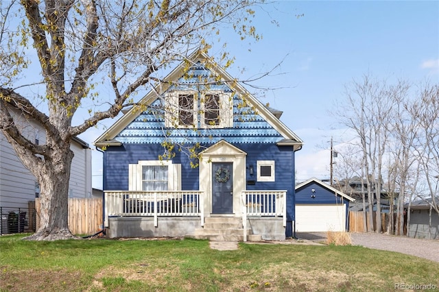 5103 Quitman St, Denver, CO 80212 - view of front of home with a porch, a garage, driveway, and an outbuilding