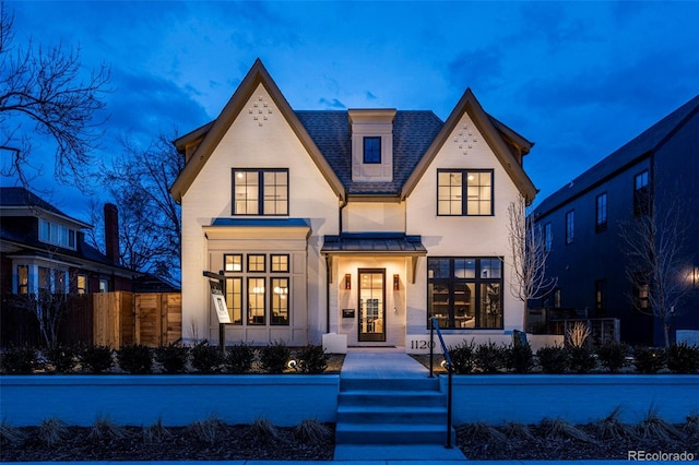 1120 S Gaylord St, Denver, CO 80210 - view of front facade with metal roof, a shingled roof, and fence