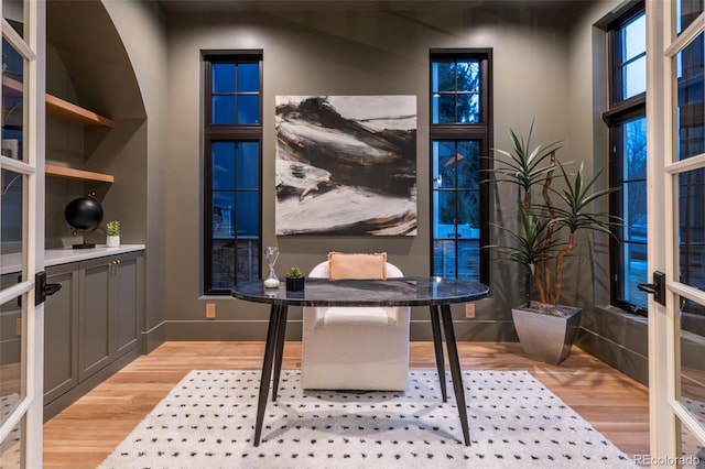 office space with wood finished floors and french doors