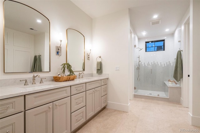 full bathroom with a stall shower, a sink, and visible vents