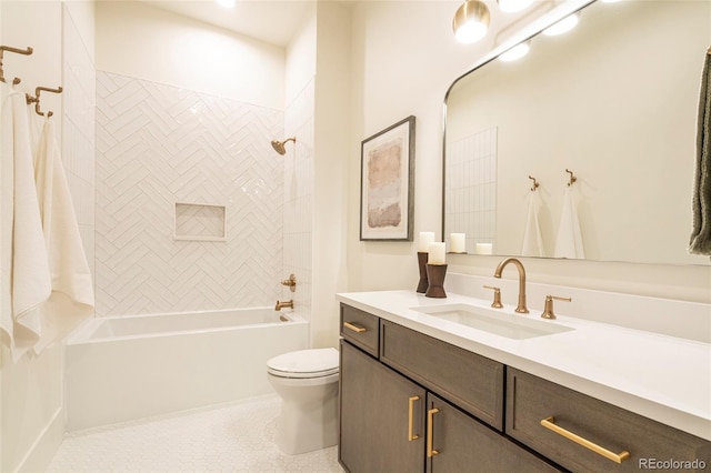 bathroom with shower / bathing tub combination, vanity, and toilet