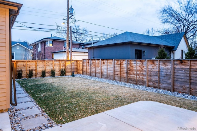 view of yard featuring a patio and a fenced backyard