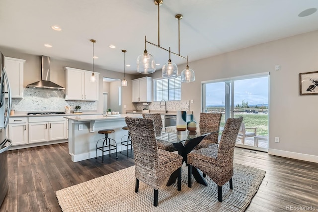 38 Morgan Cir, Erie, CO 80516 - dining room featuring recessed lighting, dark wood-style flooring, and baseboards