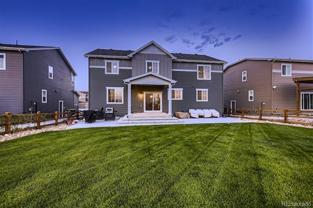 38 Morgan Cir, Erie, CO 80516 - back of property featuring board and batten siding and a patio