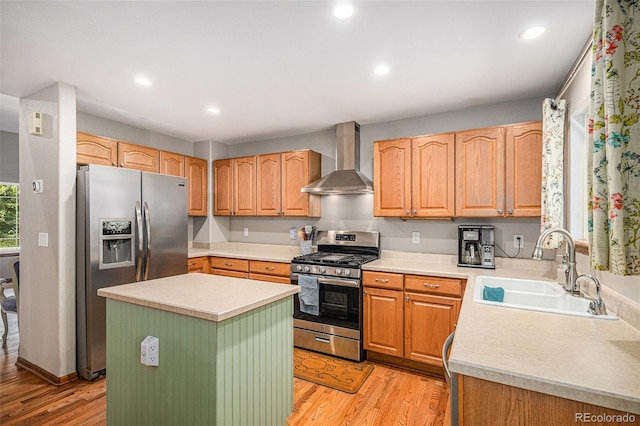 9640 Moss Rose Cir, Highlands Ranch, CO 80129 - kitchen featuring stainless steel appliances, wall chimney exhaust hood, light wood-style flooring, recessed lighting, and a center island
