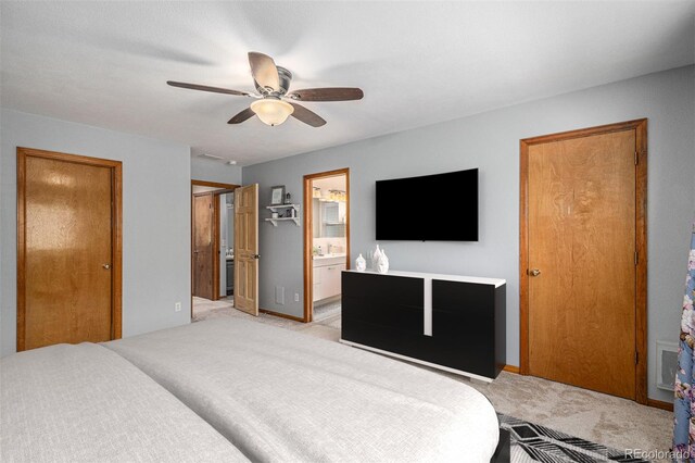 9640 Moss Rose Cir, Highlands Ranch, CO 80129 - bedroom featuring light colored carpet, ensuite bathroom, and a ceiling fan