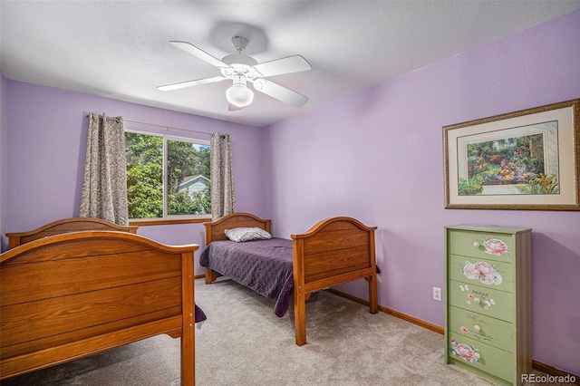 9640 Moss Rose Cir, Highlands Ranch, CO 80129 - bedroom with light carpet and a ceiling fan