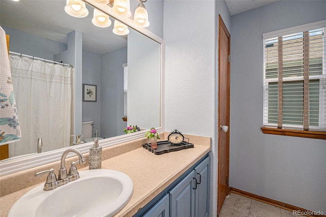 9640 Moss Rose Cir, Highlands Ranch, CO 80129 - bathroom featuring vanity and tile patterned flooring