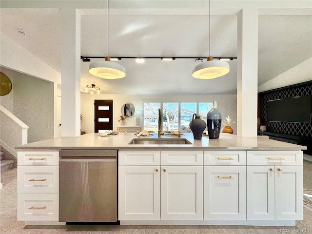 kitchen with white cabinets, decorative light fixtures, sink, and dishwasher