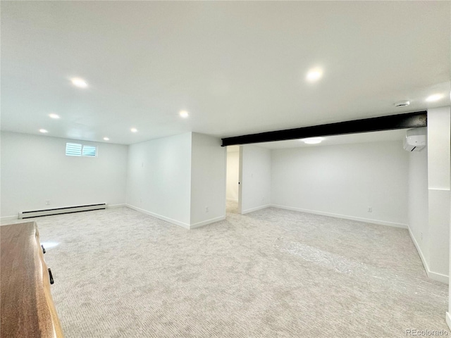 basement with light carpet, a baseboard heating unit, and a wall mounted AC