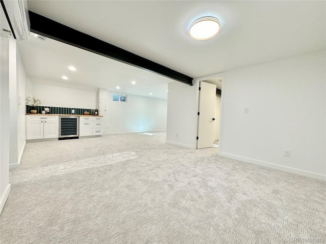 interior space featuring a wall mounted air conditioner, light carpet, bar, and wine cooler