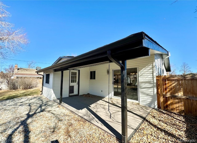 back of property featuring a deck