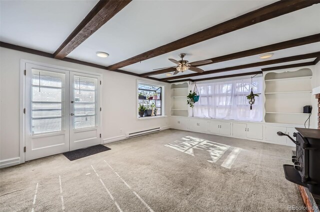 unfurnished living room with beam ceiling, ceiling fan, light colored carpet, and a baseboard radiator