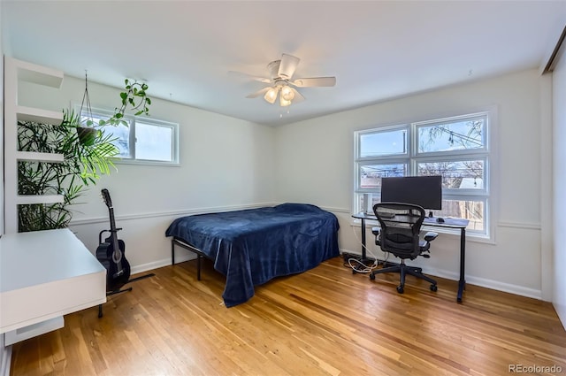 bedroom featuring wood-type flooring and ceiling fan