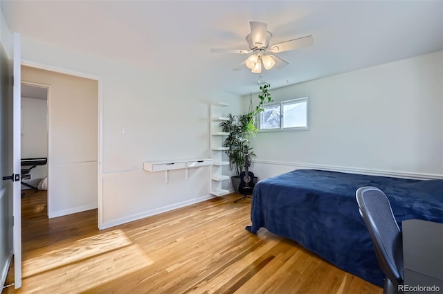 bedroom featuring hardwood / wood-style floors and ceiling fan