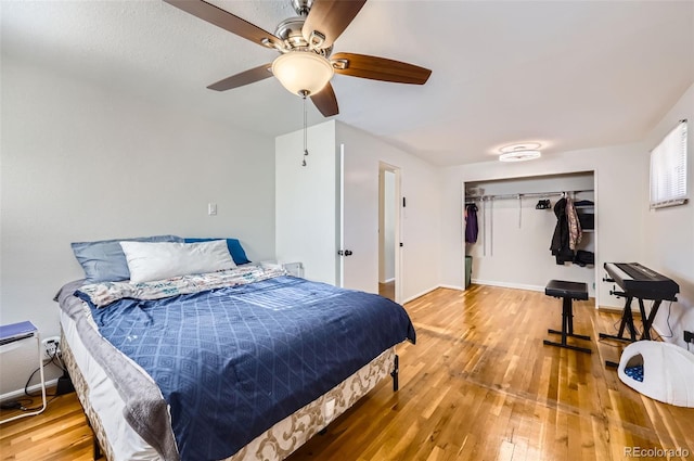 bedroom featuring ceiling fan, a closet, and wood-type flooring