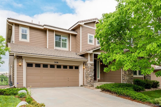 3126 Aspen Creek Dr, Highlands Ranch, CO 80129 - view of front of home featuring a garage, driveway, a tile roof, and stone siding