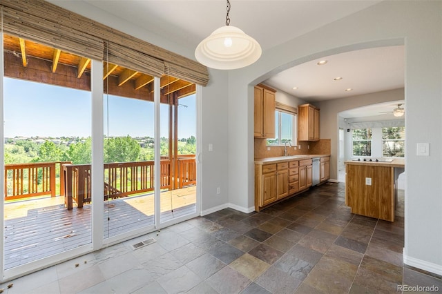 3126 Aspen Creek Dr, Highlands Ranch, CO 80129 - kitchen with baseboards, a ceiling fan, backsplash, stone tile flooring, and stainless steel dishwasher