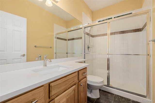 3126 Aspen Creek Dr, Highlands Ranch, CO 80129 - full bathroom featuring toilet, vanity, a shower stall, and tile patterned floors
