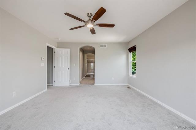 3126 Aspen Creek Dr, Highlands Ranch, CO 80129 - unfurnished room featuring arched walkways, ceiling fan, baseboards, and light colored carpet