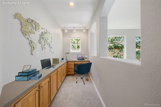 3126 Aspen Creek Dr, Highlands Ranch, CO 80129 - office area with light colored carpet, track lighting, baseboards, and arched walkways