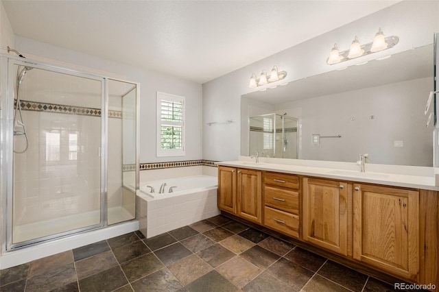 3126 Aspen Creek Dr, Highlands Ranch, CO 80129 - full bath with double vanity, a garden tub, a stall shower, and stone finish floors