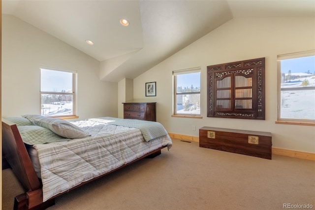 carpeted bedroom with lofted ceiling, multiple windows, and baseboards