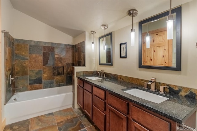 full bath featuring vaulted ceiling, double vanity, shower / washtub combination, and a sink