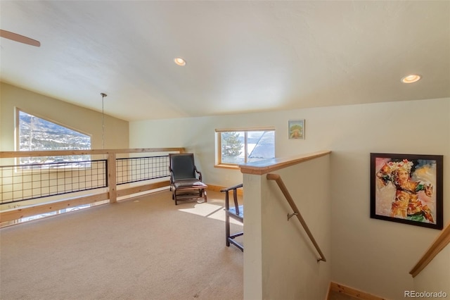 living area featuring carpet flooring, an upstairs landing, and recessed lighting