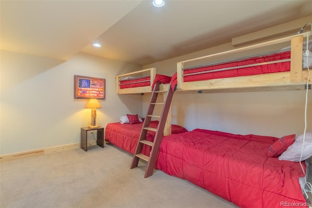 carpeted bedroom featuring baseboards and recessed lighting