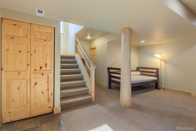 interior space with carpet, baseboards, and stairway