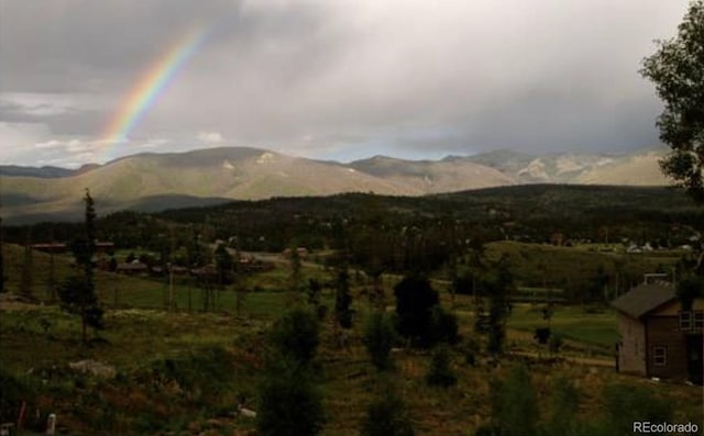 view of mountain feature with a rural view