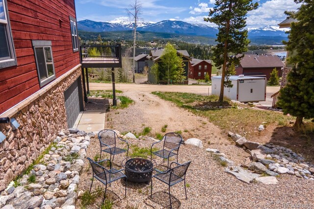 141 Gcr 4037, Grand Lake, CO 80447 - view of yard with a fire pit, a mountain view, and a balcony