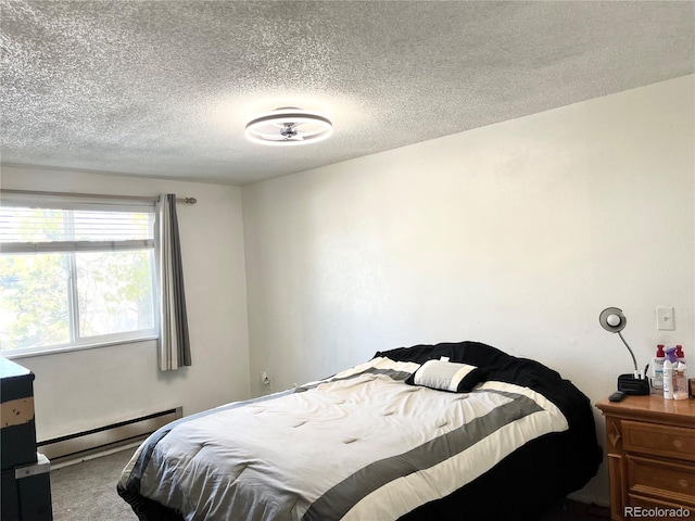 bedroom featuring carpet flooring, a textured ceiling, and baseboard heating