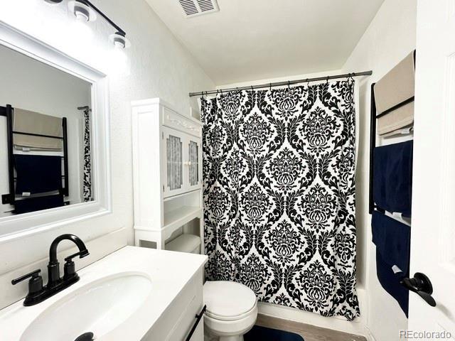 17413 E Louisiana Ave, Aurora, CO 80017 - bathroom with toilet and vanity